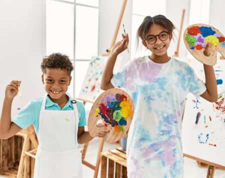 kids smiling with paints