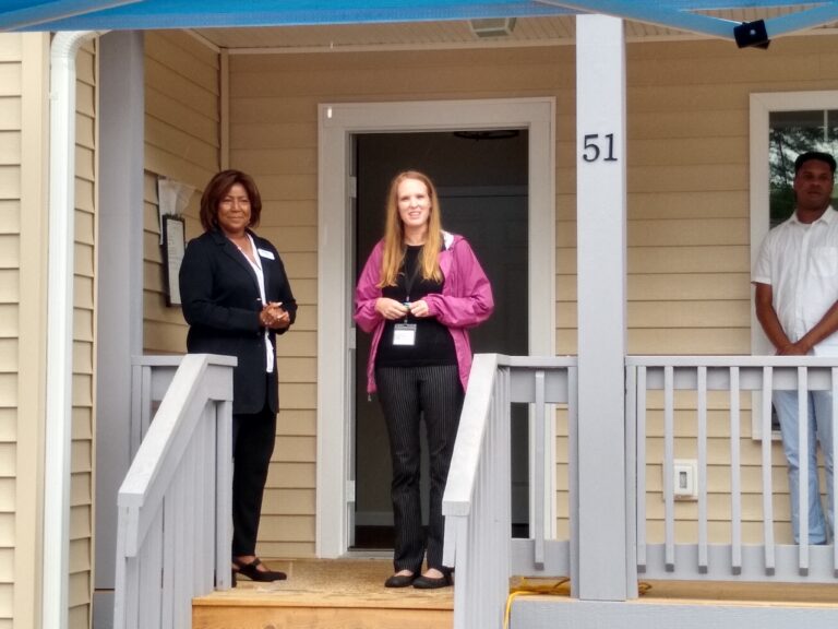 Vice Mayor Sanra Kilgore stnads with new Habitat for Humanity homeowner