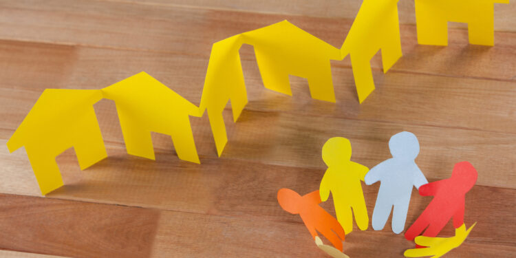 yellow paper house on a paper chain