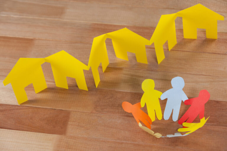 yellow paper house on a paper chain