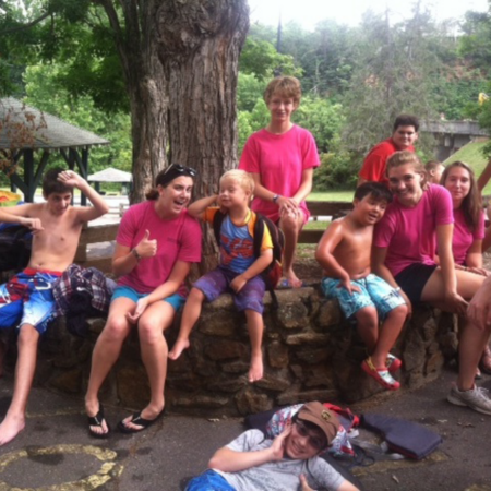 therapeutic recreation participants sitting under a tree