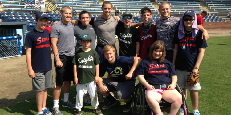 therapeutic recreation group photo on a baseball field