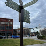 sister city street sign in pack square park