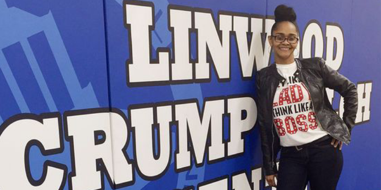 tameka crudup standing in front of banner sign at shiloh center