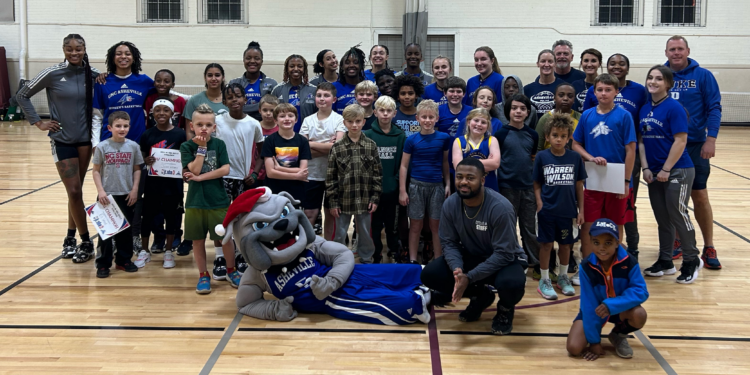 jay houston in group photo with adults and children