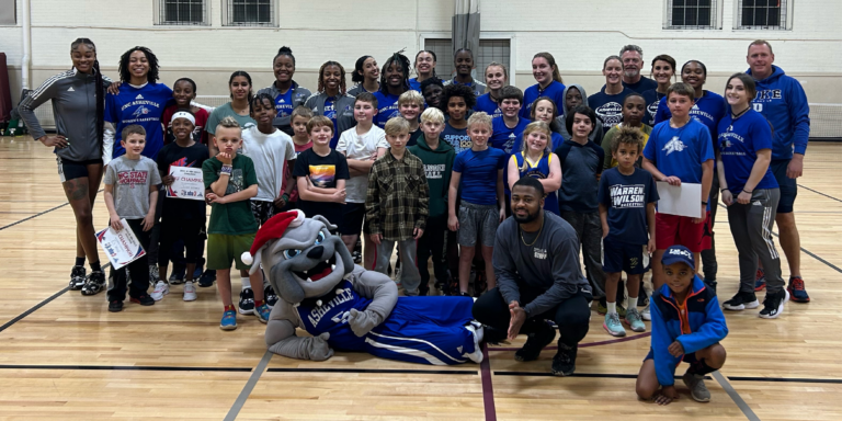 jay houston in group photo with adults and children