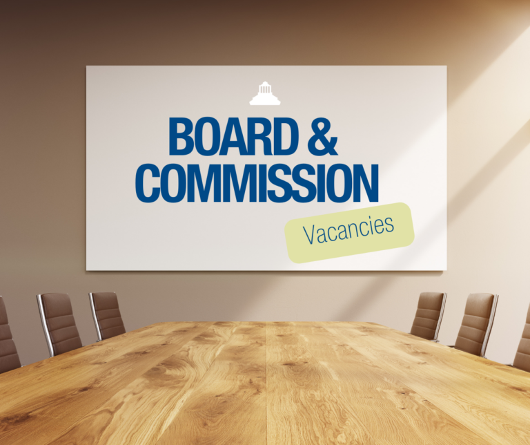 board room with boards and commission vacancies written on the wall