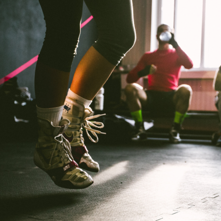 person jump roping showing white shoes