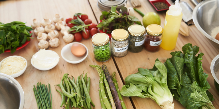 table of fresh vegetables and canned food