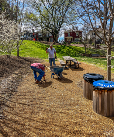 two men working in mulch and plantings at oakhurst park