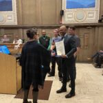 ART STAFF STANDING WITH COUNCIL MEMBER RECIEVING PROclamation