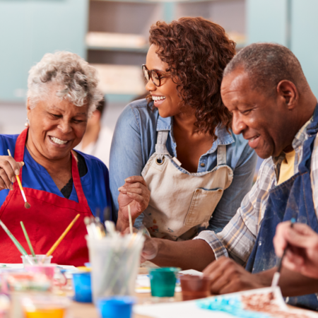 three older adults in art class
