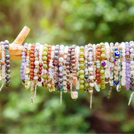 colorful bracelets on wooden display