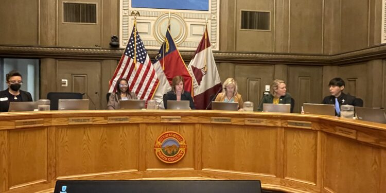 Six Xounxil members on dias May 13, 2025