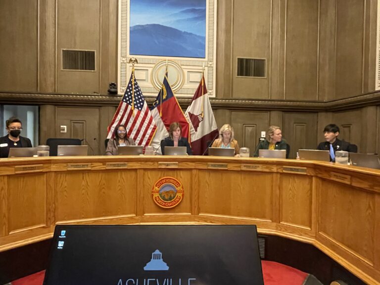 Six Xounxil members on dias May 13, 2025
