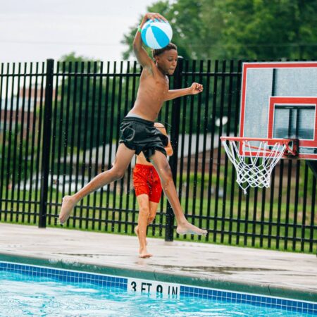 two boys playing pool basketball