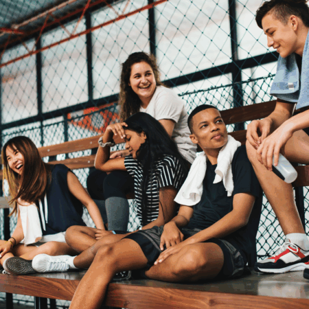 youth sitting on bleachers