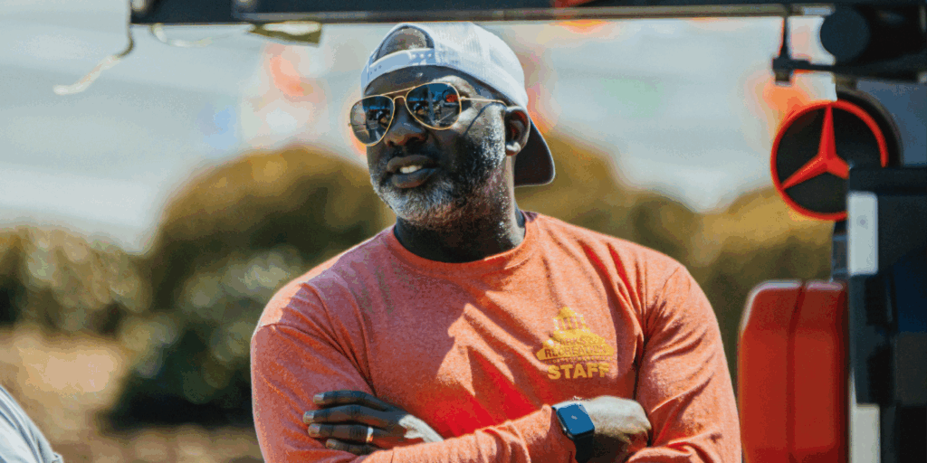 parks and recreation director D. Tyrell McGirt wearing orange shirt and sunglasses