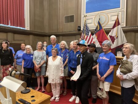 Council member Bo Hess reads proclamation in front of senior community center users at June 24, 2025 council meeting