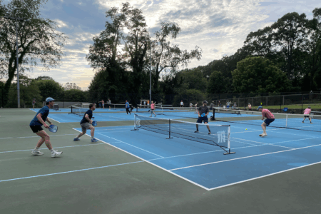 pickleball players on blue  court