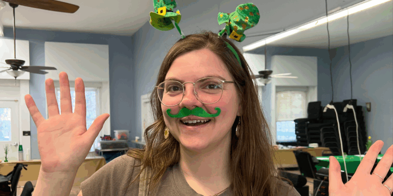 Rebecca Familette wearing St. Patricks headband and green mustache