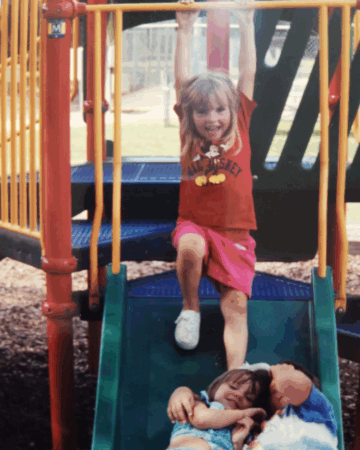 Rebecca Familette as a child on a playground slide