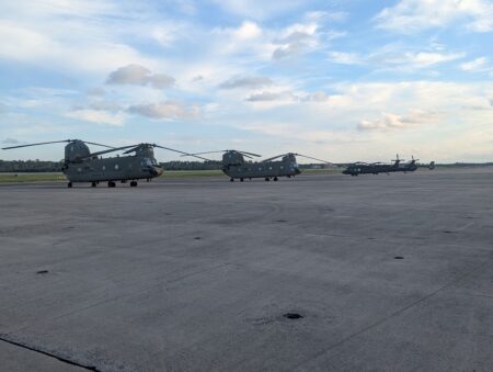 military helicopters on landing strip