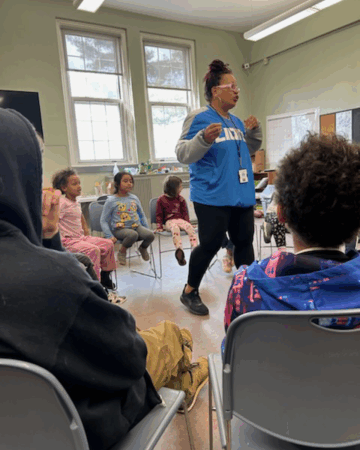 leader speaks to group of young adults