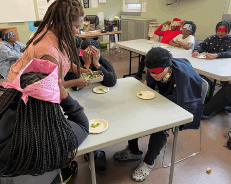 group of teens doing blind folded taste testing