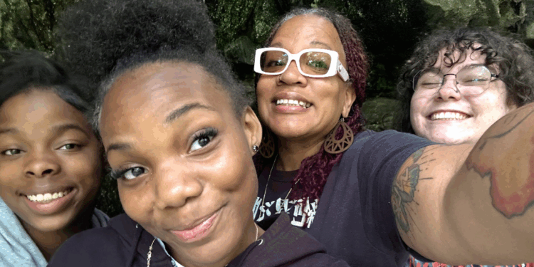 4 young women taking a close up selfie