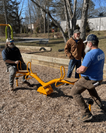 Brandon Reese tests seesaw on playground