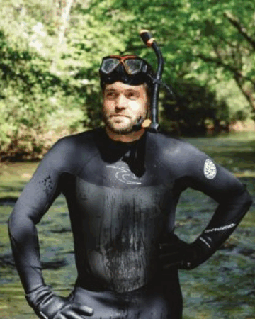 Daniel Manget in scuba gear near river