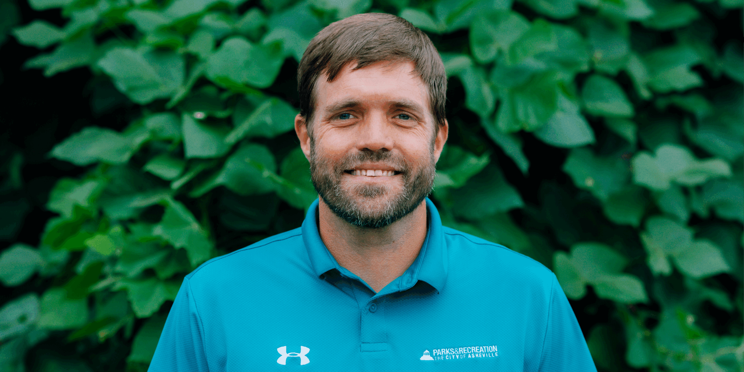 Parks & Recreation employee Daniel Manget wearing a turquoise shirt