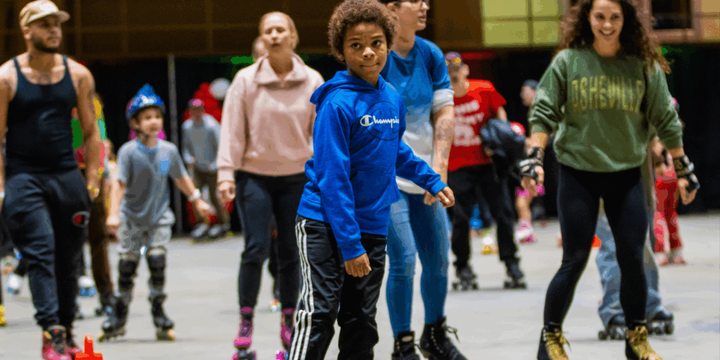 multiple people of all ages roller skating
