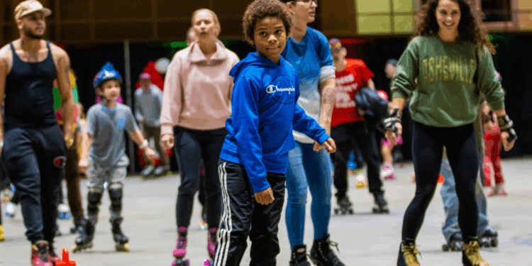 multiple people of all ages roller skating