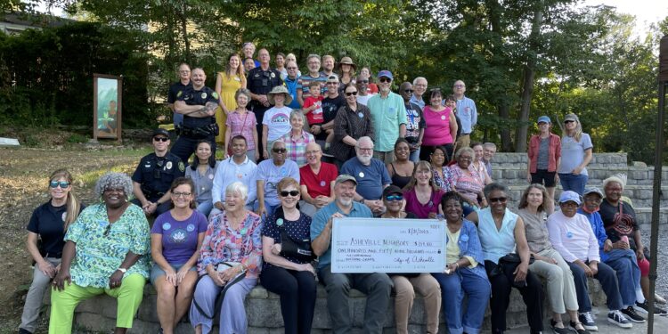 Neighborhood Matching Grant recipients with check in a group photo