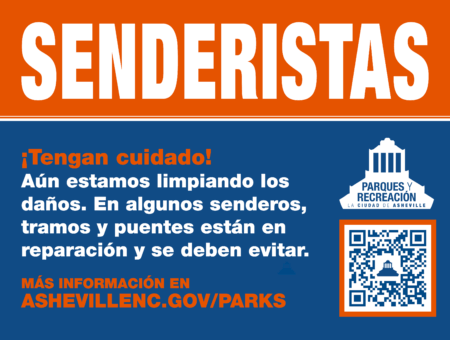 sign in spanish that says Trail Users Please Use Caution