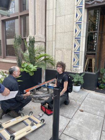 artist measuring site for installation