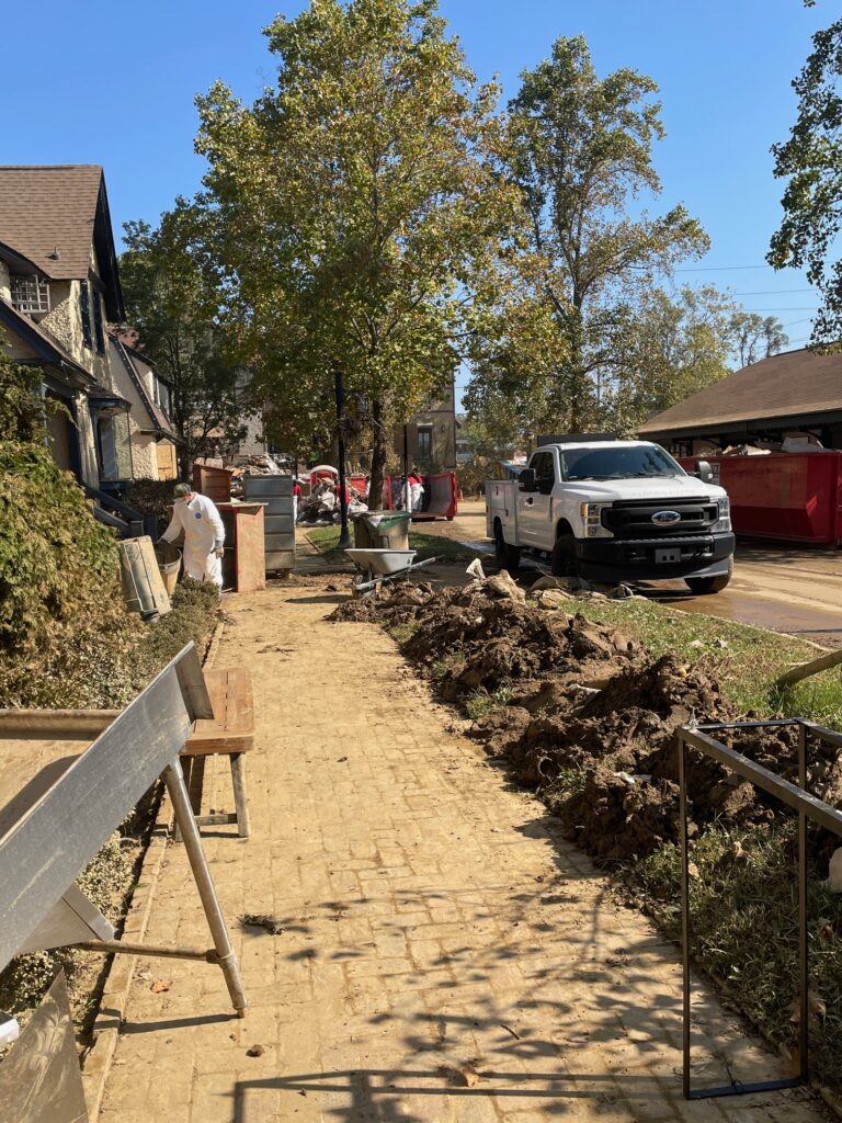 debris and mud on the sidewalks in Biltmore Village directly after Tropical Storm Helene