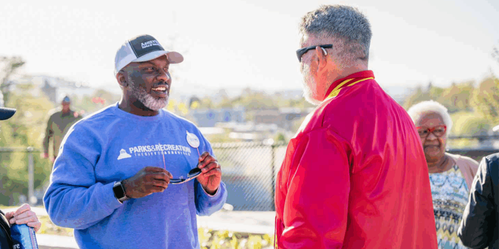 Parks and Recreation Director D. Tyrell McGirt speaks with community member