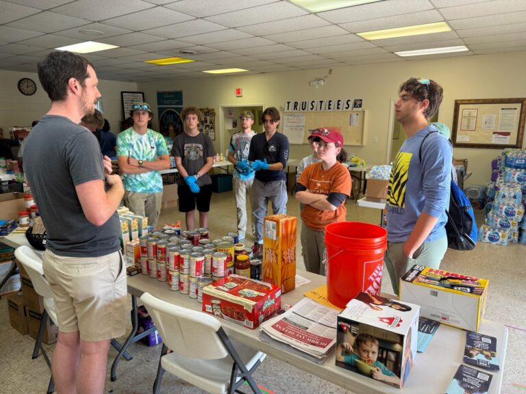 community members gather at East End Valley Street to sort and distribute food