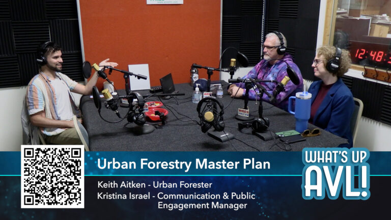 three members particiapting in podcast seated in the studio in front of microphones
