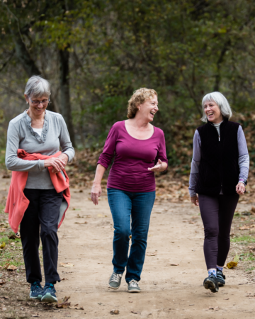 adults walking on greenway