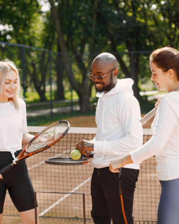 adults on a tennis court