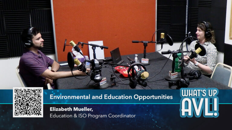 Sam and Elizabeth in studio in front of microphones