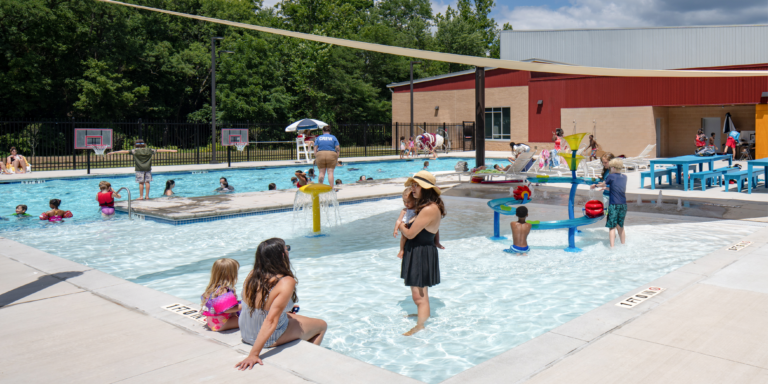 community members in a swimming pool