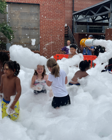 kids playing in a mountain of foam