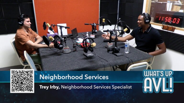 Sam and Trey in studio in front of microphones. Graphic : Neighborhood Services and Trey's title of Neighborhood Serivces Specialist
