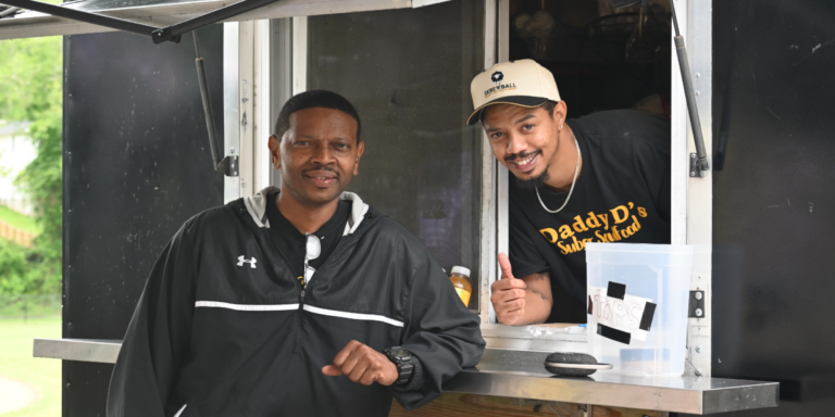 food truck vendor speaking with a customer
