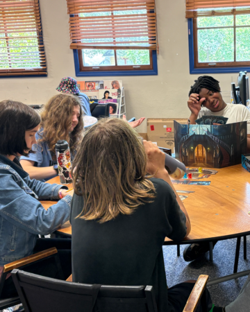 teens playing a tabletop game